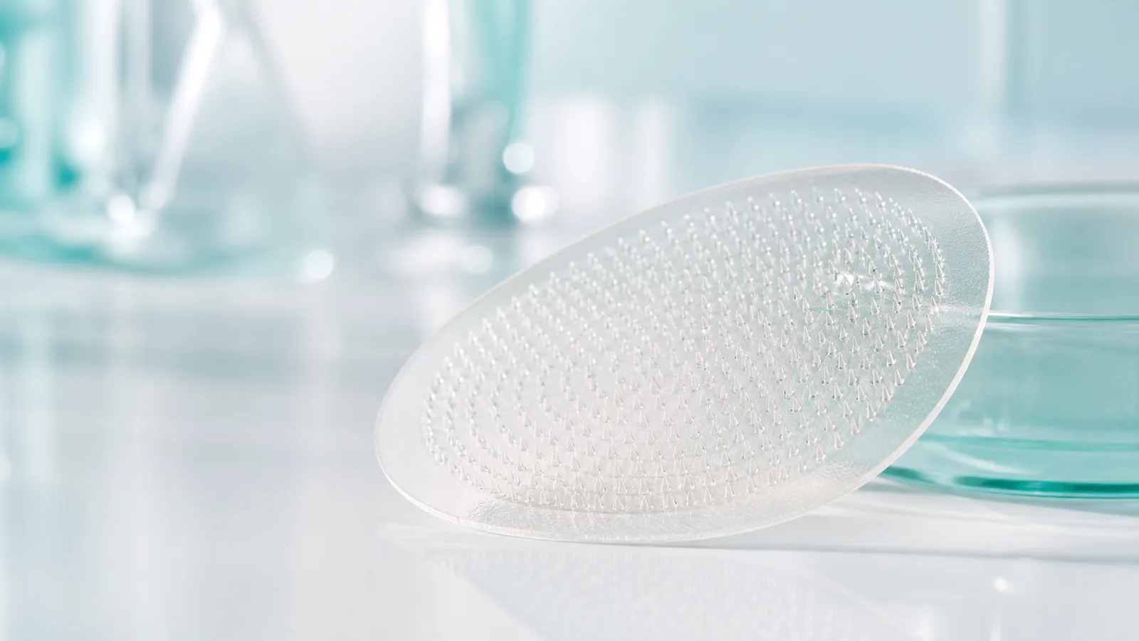 Dissolvable cosmetic microneedle patch array in a clean formulation laboratory